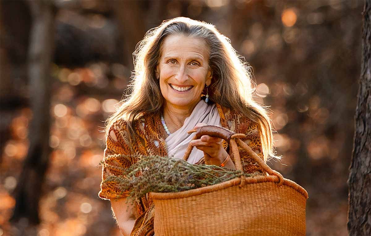 Ajeet Khalsa with a basket of gathered herbs, by Melissa Stissi